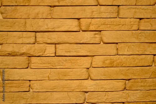 The texture of the bricks beige on the kitchen wall 