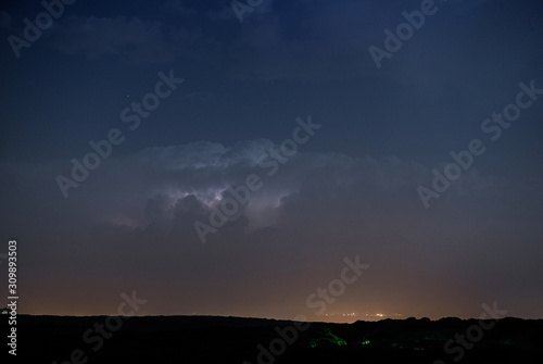 Thunderstorm clouds at night with lightning © Artem Merzlenko