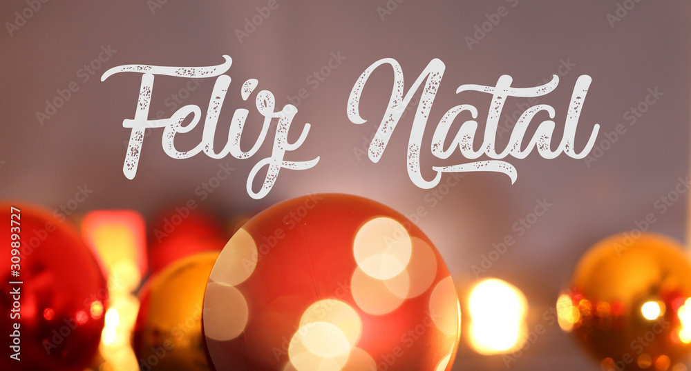 Naklejka premium Christmas greetings with portuguese text Feliz Natal (merry christmas) and Christmas baubles
