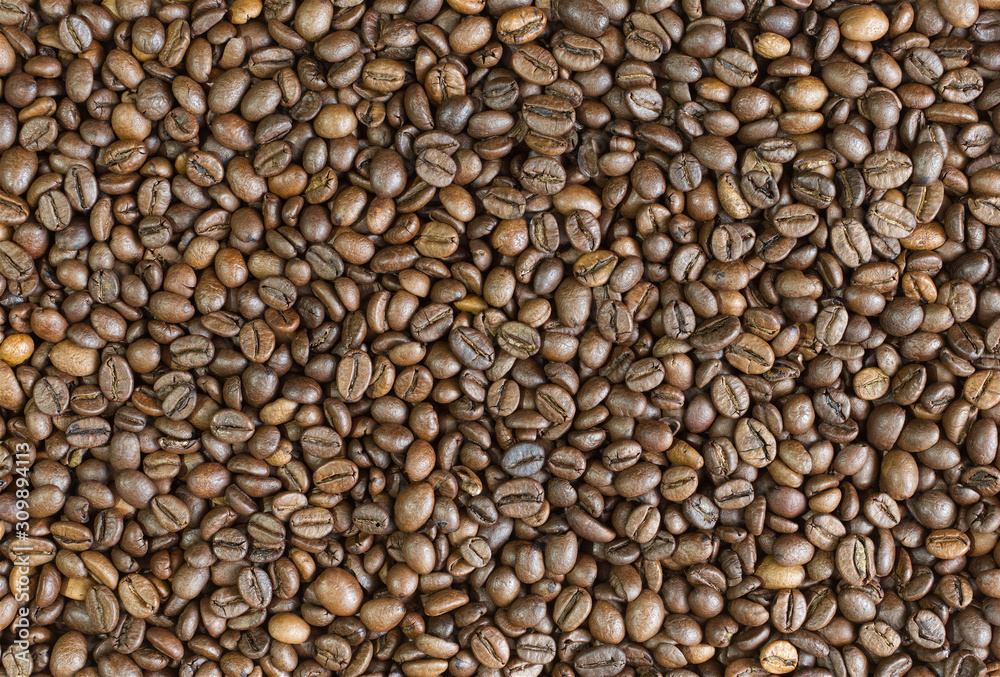 Coffee beans background top view. Arabica strong roast. Coffee beans background top view. Arabica strong roast.