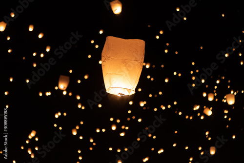floating paper lanterns in the sky