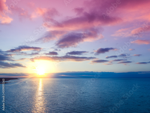 Sunset over the sea. Sea landscape in the evening. Beautiful sunset with dramatic sky. Aerial view © vvvita