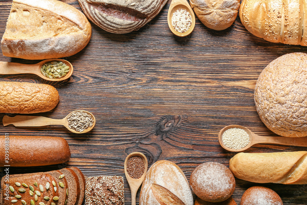 Assortment of fresh bread with seeds on table Assortment of fresh bread with seeds on table