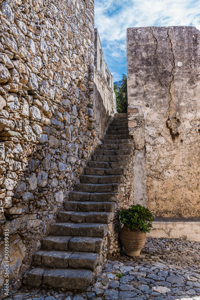 A long staircase at the stone wall