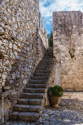 A long staircase at the stone wall