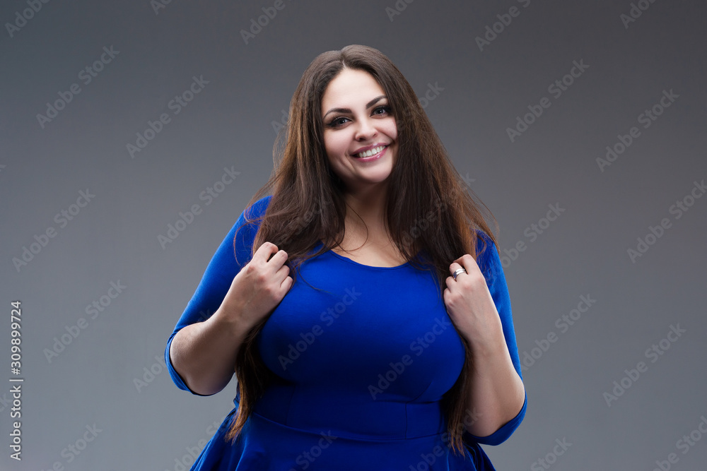 Happy Plus Size Model In Blue Dress, Fat Woman With Long Hair On Gray  Background, Body Positive Concept Stock Photo | Adobe Stock