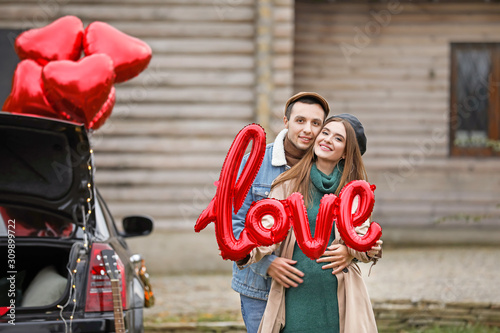Happy young couple with air...