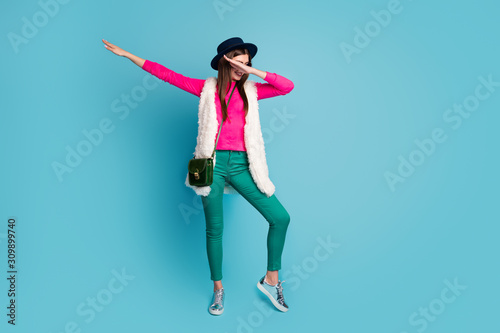 Full length body size view of her she nice attractive cheery fashionable girl dancing dab move having fun free time isolated on bright vivid shine vibrant green blue turquoise color background