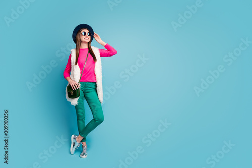 Full length body size view of her she nice attractive pretty cheerful cheery girl traveling abroad world sight seeing isolated on bright vivid shine vibrant green blue turquoise color background