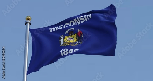 Wisconsin flag blowing in the wind with blue sky