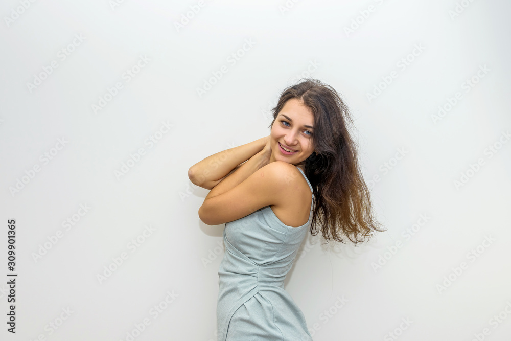 Fashion woman in elegant dress touching her hair. Sensual portrait of attractive woman Fashion woman in elegant dress touching her hair. Sensual portrait of attractive woman