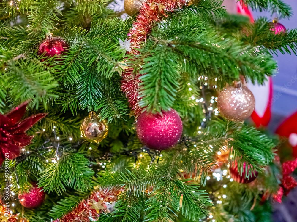 Fototapeta premium Selective focus on a decorated Christmas tree
