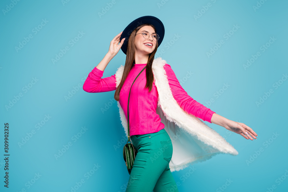 Portrait of her she nice-looking attractive pretty charming dreamy cheerful cheery brown-haired girl walking isolated on bright vivid shine vibrant green blue turquoise color background