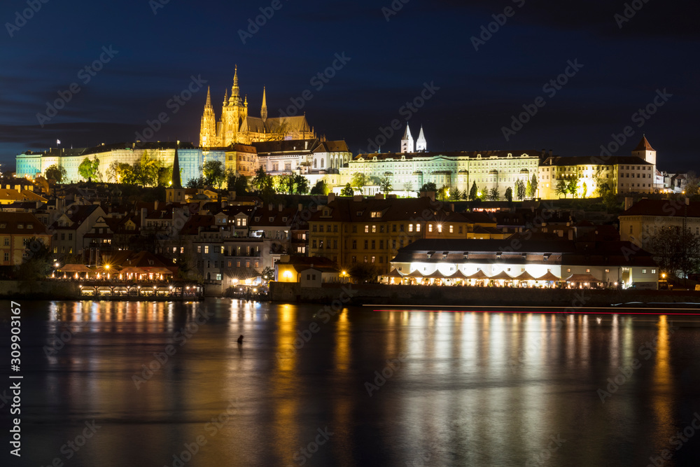 Night View of colorful old town and Prague castle with river Vltava, Czech Republic