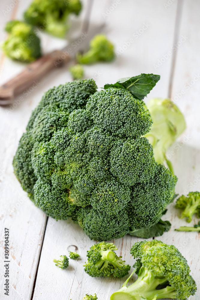 Fresh green broccoli on a white rustic wooden table Fresh green broccoli on a white rustic wooden table