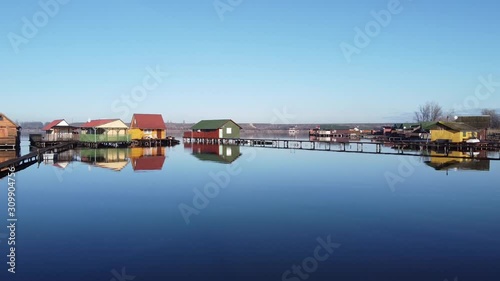 Wooden fishing house on lake