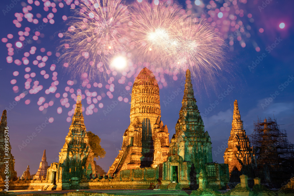 Fototapeta premium Beautiful Buddhist temple at night with fireworks for celebrations.