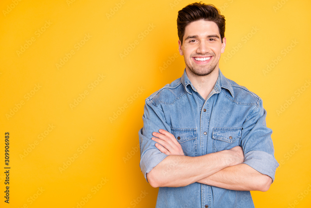 Photo of cheerful positive man standing confidently smiling toothily with hands folded isolated bright color background Photo of cheerful positive man standing confidently smiling toothily with hands folded isolated bright color background