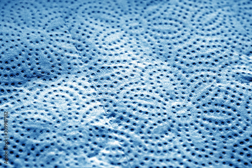 Paper towel surface with blur effect in navy blue tone.