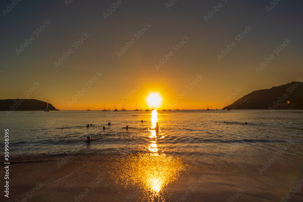 Beautiful sunset silhouette at Nai Harn Beach, Phuket, Thailand. Beautiful sunset silhouette at Nai Harn Beach, Phuket, Thailand.
