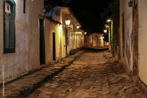 Atmospheric night view of illuminated street and buildings in historical center of Paraty, Brazil, Unesco World Heritage © Uwe Bergwitz