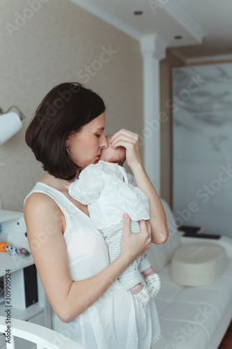 A young mother with her newborn baby.