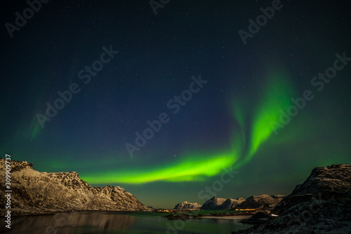 beautiful aurora borealis, polar lights, over mountains in the North of Europe - Lofoten islands, Norway © Tatiana