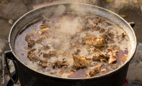 Kavurma is a Turkic sheep meat dish. Pieces of meat are stewed in a large cauldron over an open fire.