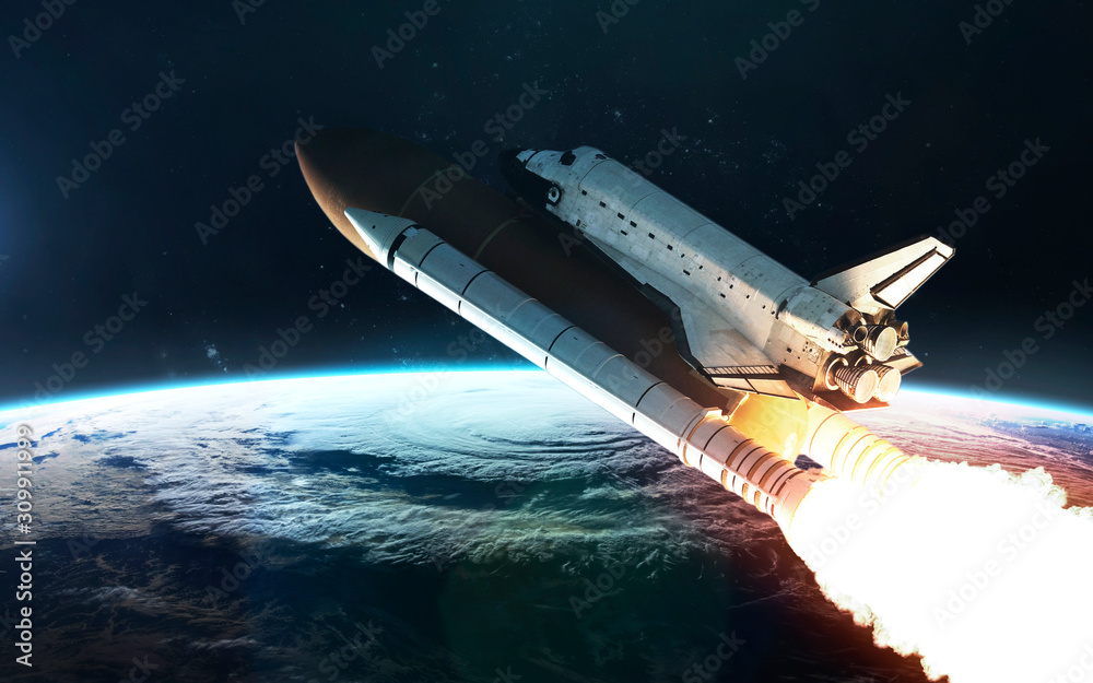 Space shuttle moves to Earth orbit. Elements of this image furnished by NASA