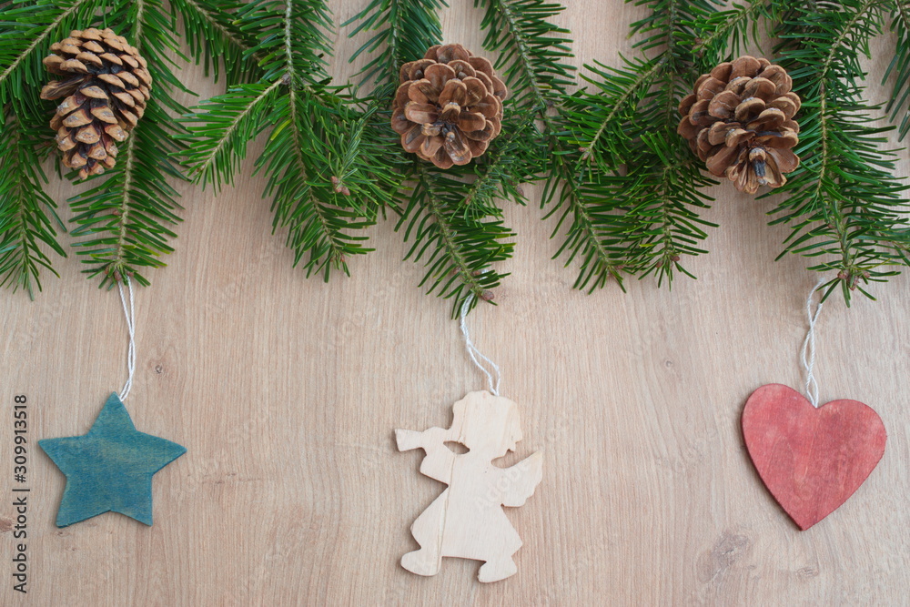 Christmas flat lay with pine branches, Christmas ornaments and pine cone on a wooden background Christmas flat lay with pine branches, Christmas ornaments and pine cone on a wooden background