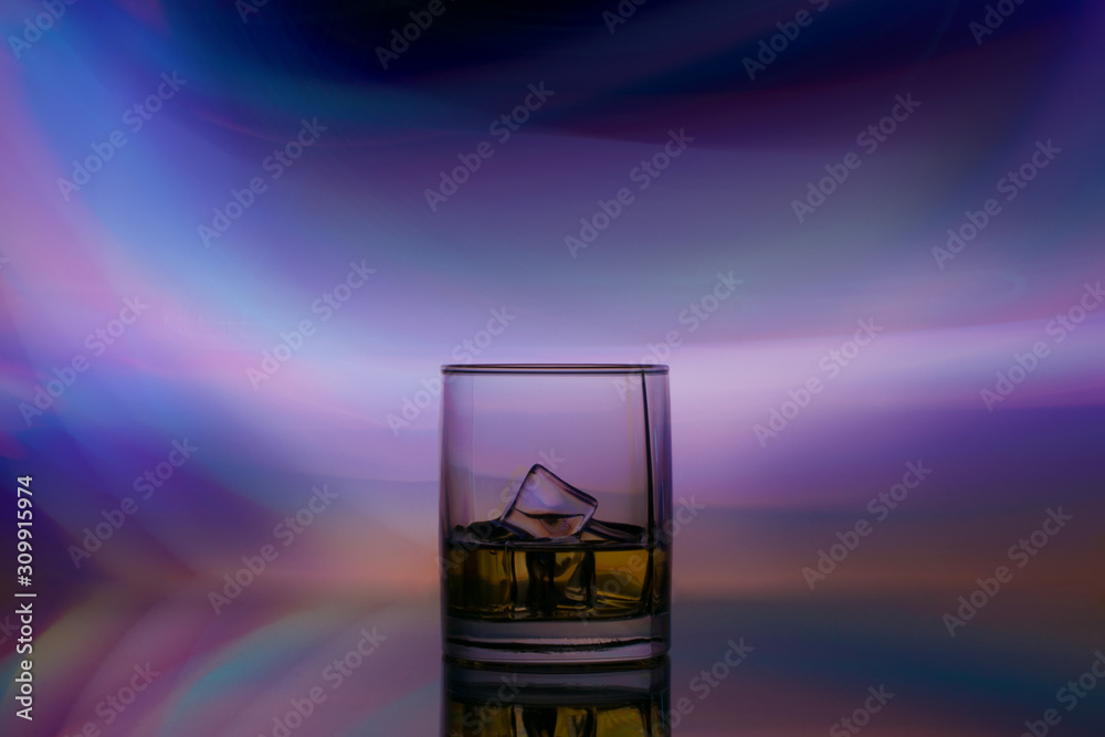 glass alcohol drink in spotlight