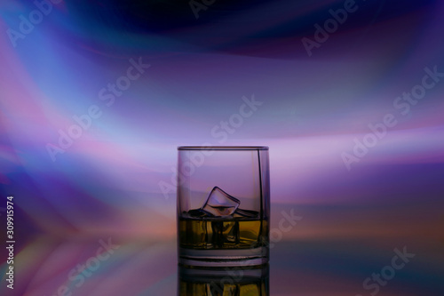 glass alcohol drink in spotlight