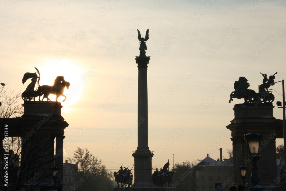 silhouette of Statues and sculptures in Heroes' square monument in sunset in Budapest Hungary