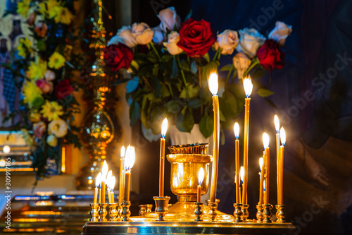 Burning candles in orthodox church