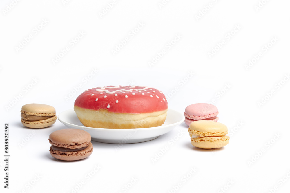 decorative donuts and macrons on a white surface decorative donuts and macrons on a white surface