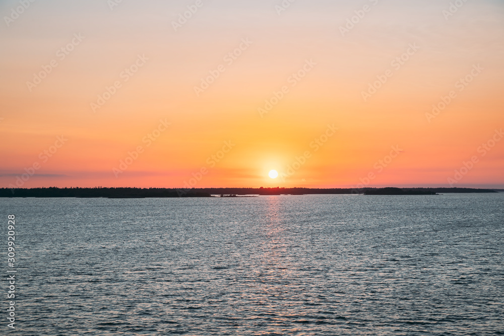 Sweden. Beautiful Seascape In Sunset Sunrise Time. Sun Sunshine Above Rocky Islands Archipelago. Sunny Summer Evening