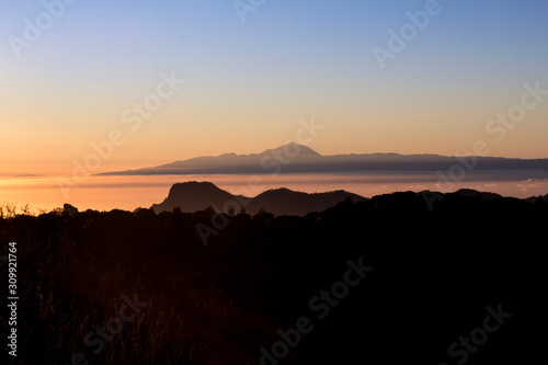 Amazing view sunset at Roque Nublo park and Teide peak