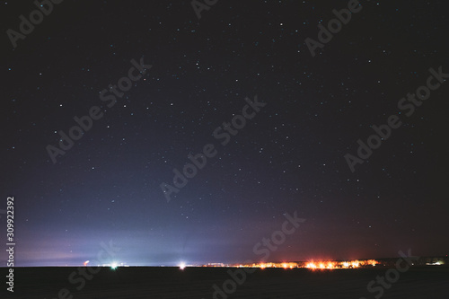 Real Night Sky Stars Background With Natural Colourful Sky Gradient. Sunset, Sunrise Light And Starry Sky. Yellow And Black Colors