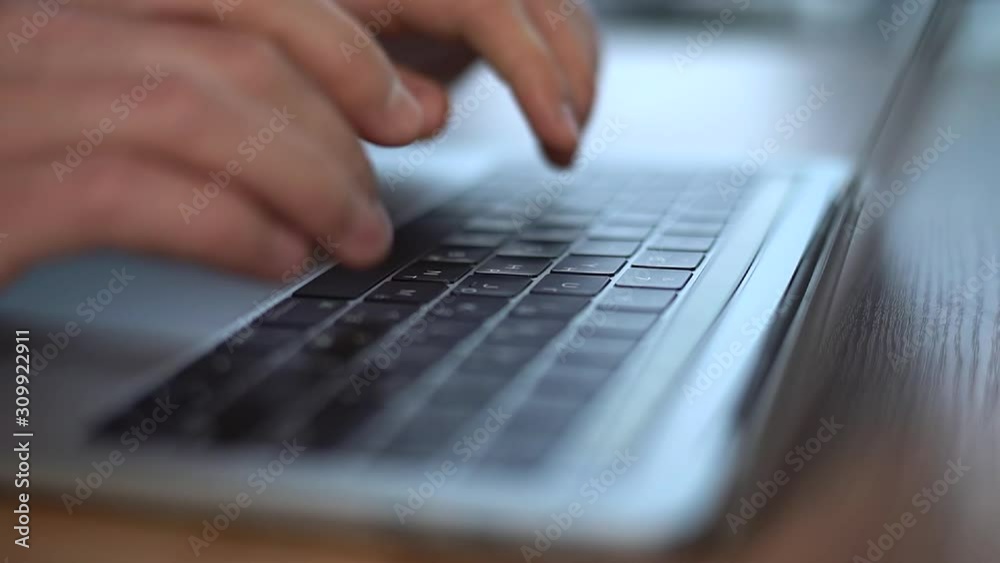 4k Close-up of male hands typing on laptop keyboard, moving camera 4k Close-up of male hands typing on laptop keyboard, moving camera