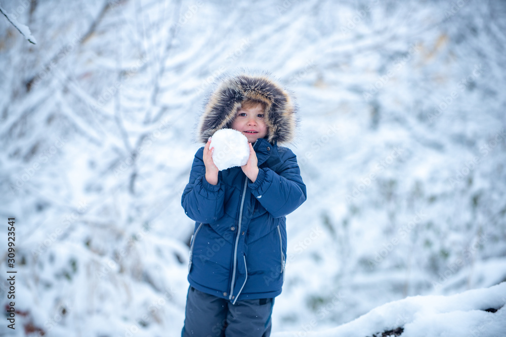 Winter at countryside. Little child boy walking in winter field. Well dressed enjoying the winter. Kids winter portrait. Winter at countryside. Little child boy walking in winter field. Well dressed enjoying the winter. Kids winter portrait.