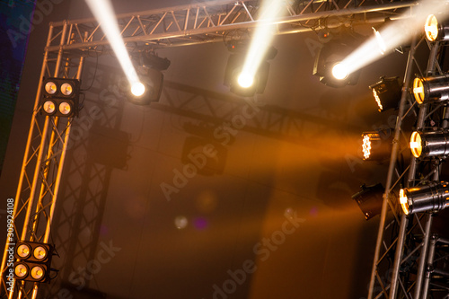 Performance moving lighting luminous rays on construction light beam ray downward in yellow color  on Concert and Fashion Show stage ramp