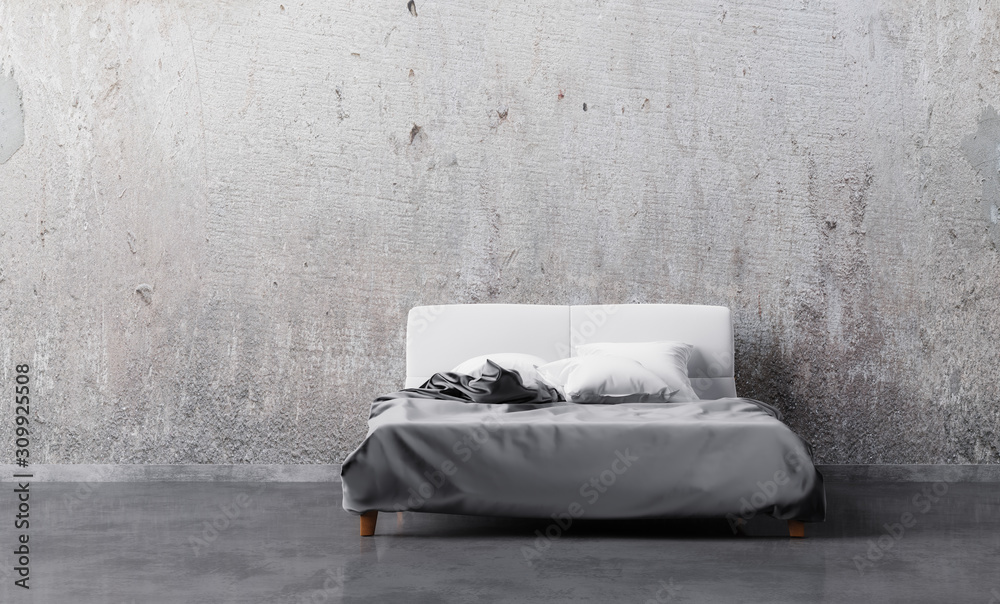 Bed with satin linen and pillows in empty room with grunge wall
