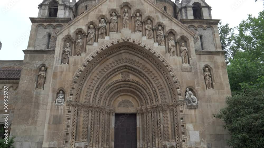 a walk and tilt up gimbal shot of the front of jaki chapel in budapest, hungary a walk and tilt up gimbal shot of the front of jaki chapel in budapest, hungary