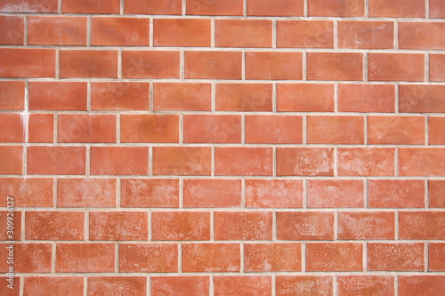 orange brick block wall . horizontal picture .