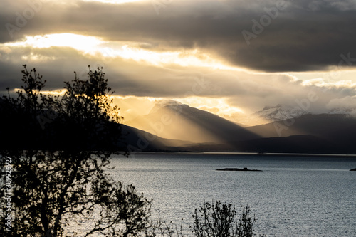 Sunrays over fjord © Photodoc