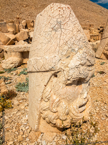 Panoramic view of some of the statues near the peak of Nemrut Dagi. King Antiochus I Theos of Commagene built on the mountain top of Mount Nemrut a tomb-sanctuary flanked by huge statues. Turkey