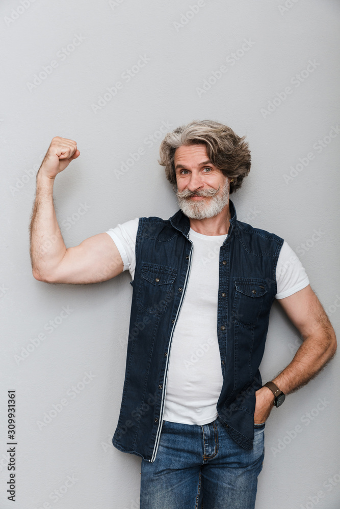 Portrait of a handsome stylish mature man wearing a vest Portrait of a handsome stylish mature man wearing a vest