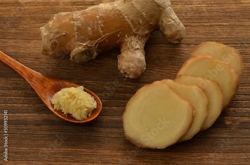 Ginger on a wood background photo