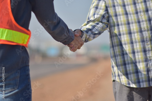 Engineering hands shake at work place building construction estate project success,Business people shake hand agreement investment business © Suriyo