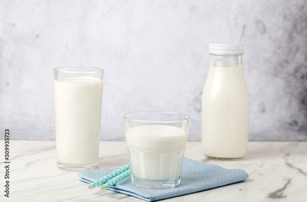 Dairy products, health concept, in glassware, on a light gray background Dairy products, health concept, in glassware, on a light gray background